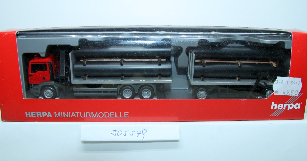 Herpa 305549, MAN TGS M flatbed trailer train with loading crane and pipes as load , 