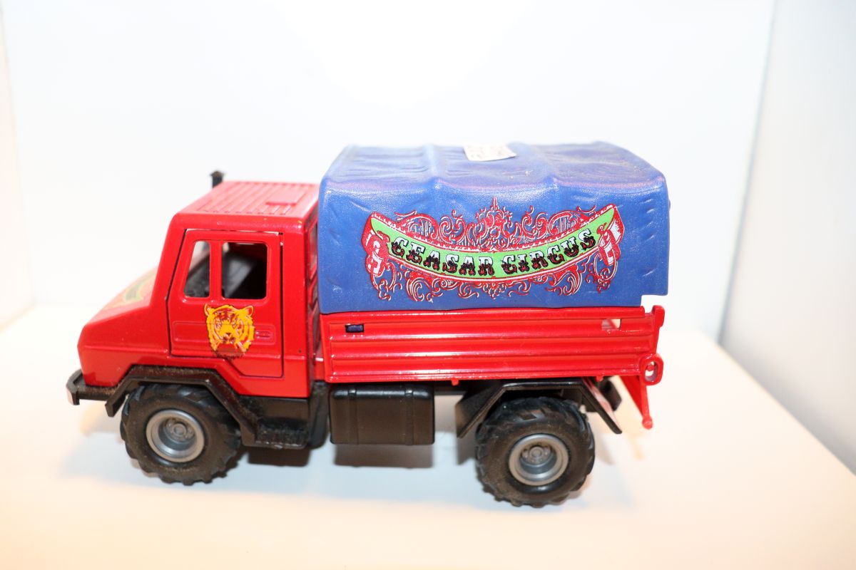 Welly SW21464, Mercedes Benz Unimog 1750 + Zirkuswagen, "Caesar Circus", blau/rot