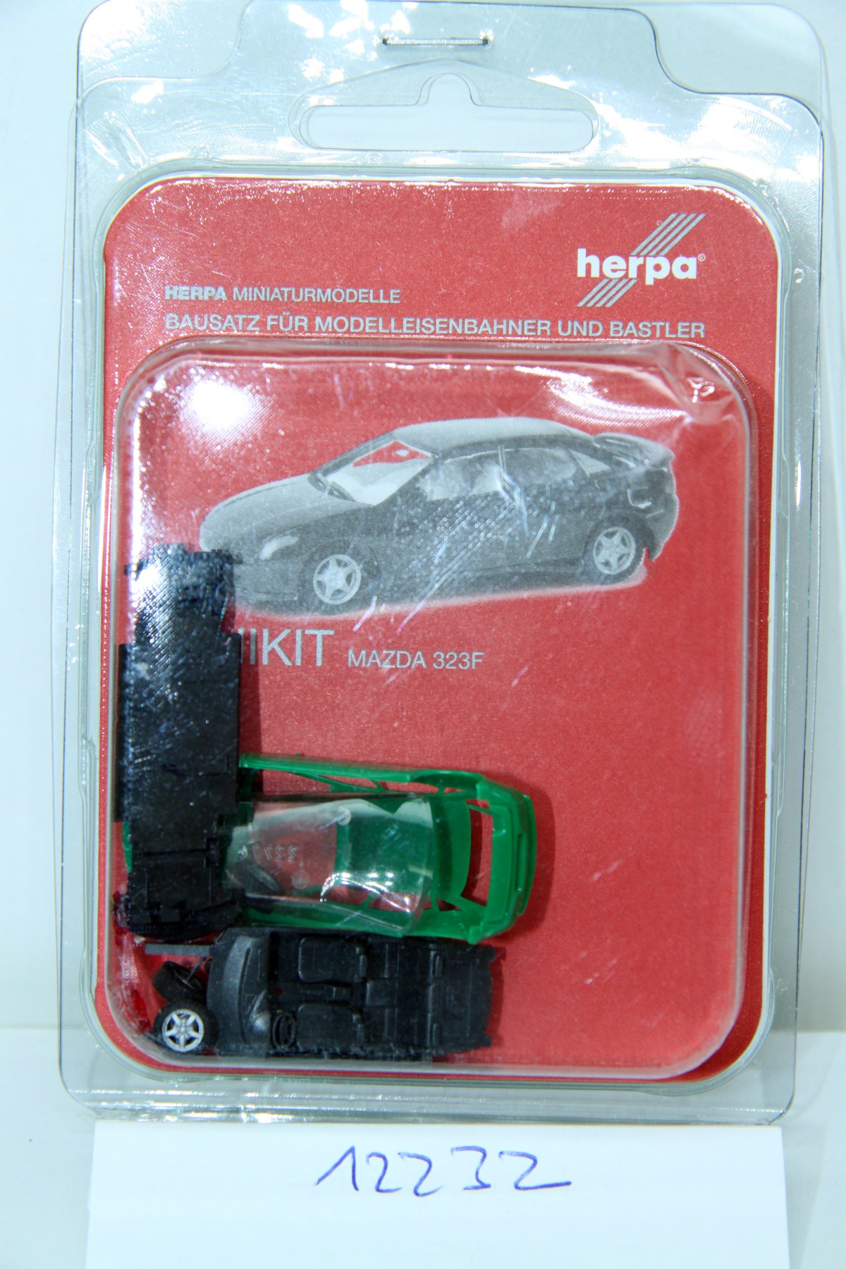 Herpa 012232, Minikit Mazda 323F, green, for H0 gauge, with original box.